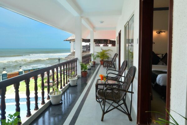 Relaxing swimming pool area at B’Canti Boutique Beach Resort Varkala